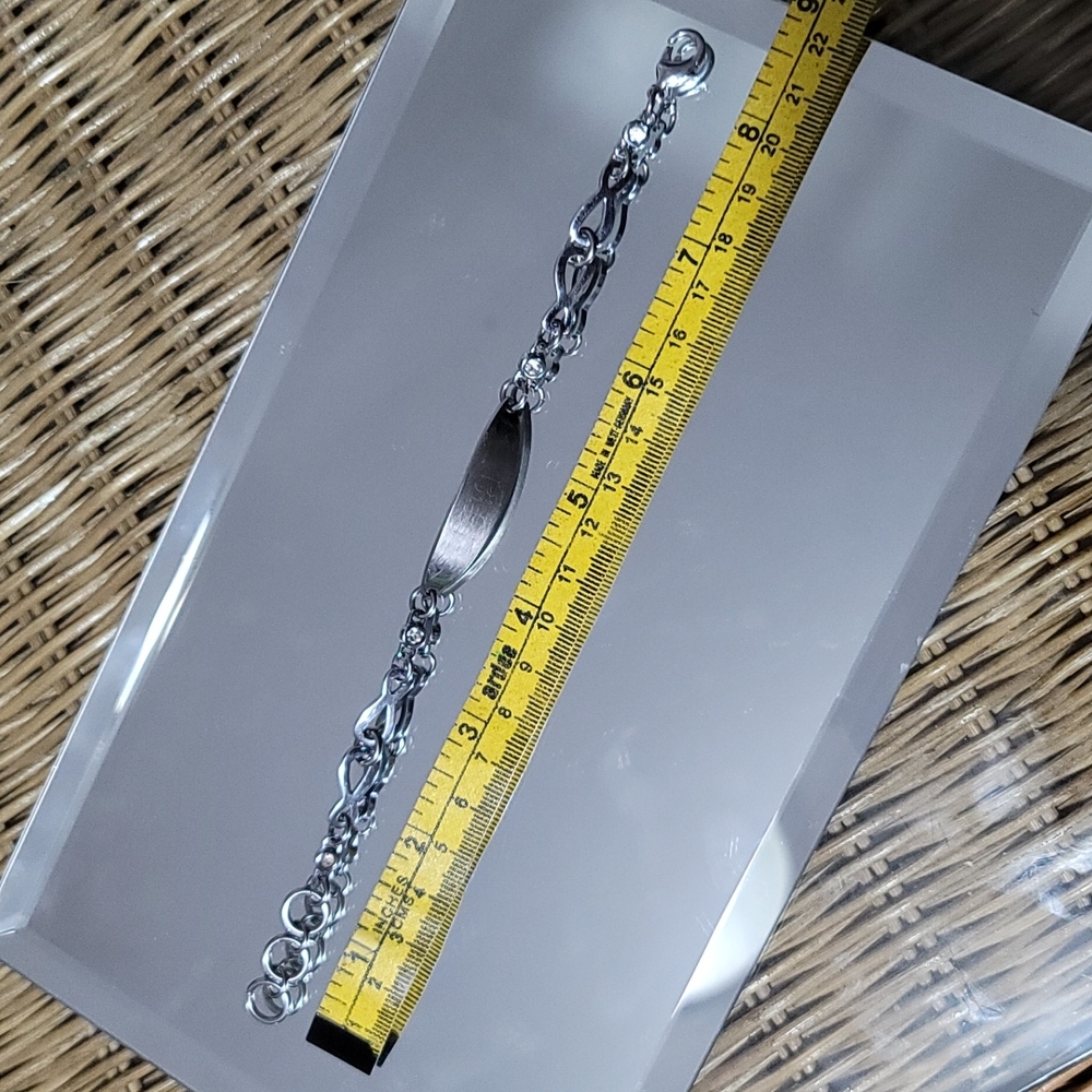 Stainless steel bracelet with two stones of each side engravable plate like new